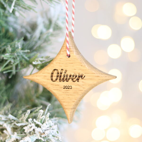Solid oak star Christmas tree decoration engraved with name