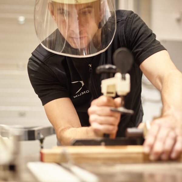 MijMoj staff cutting oak on the table saw in Flint wood workshop