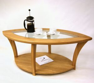 Bespoke oak and glass coffee table shaped like a leaf