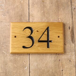 Oak house number plaque in solid oak with number 34 engraved and painted in black