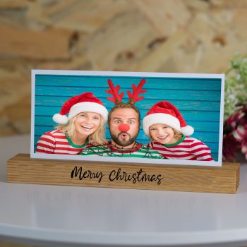 Oak photo block with 'Merry Christmas' engraved. Family photo with Sata hat and elf antlers.