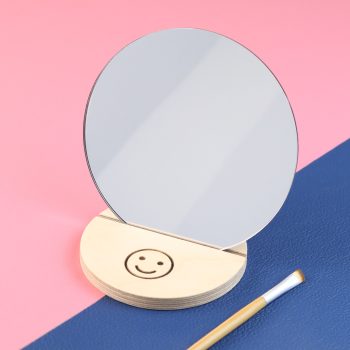Smiley compact mirror with brush